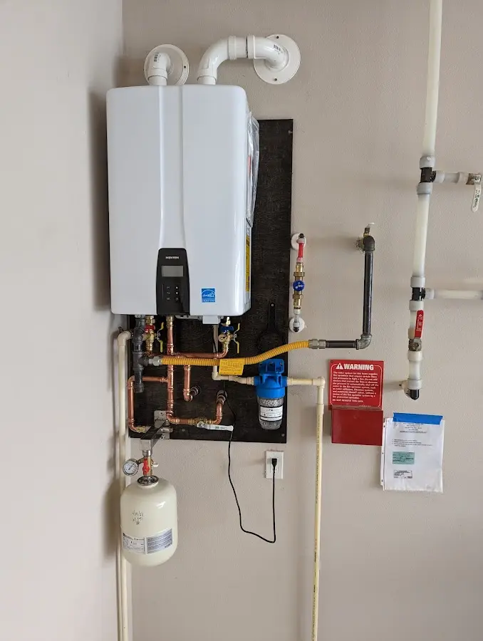 Professional plumber installing copper piping in a Lynwood home